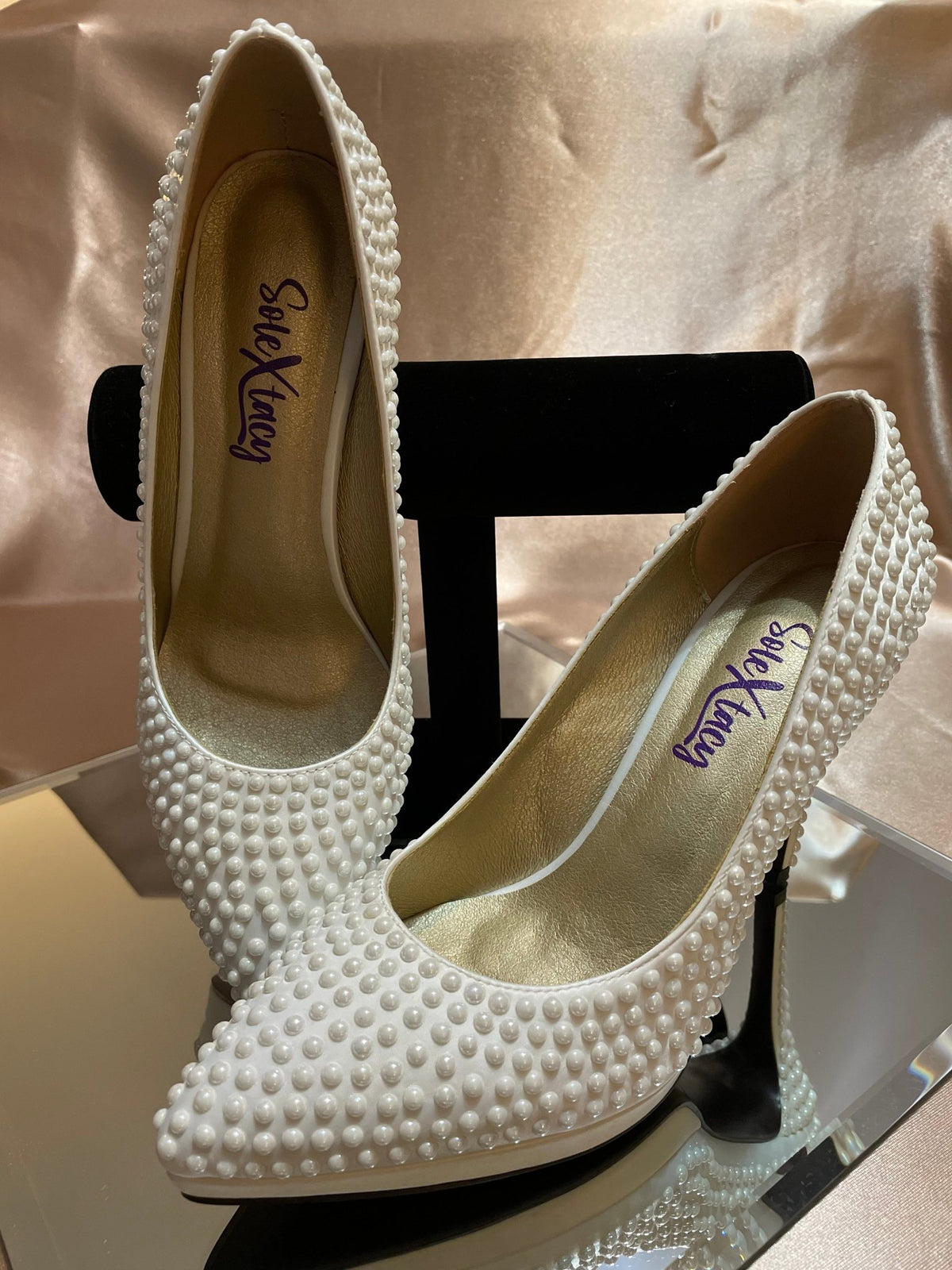 Pearl-studded satin platform pumps with pointed toe and black heel blocks