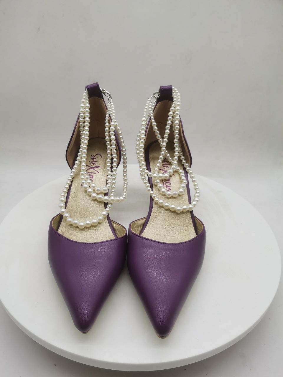 Purple pointed heeled pumps with white pearl-bead ankle straps