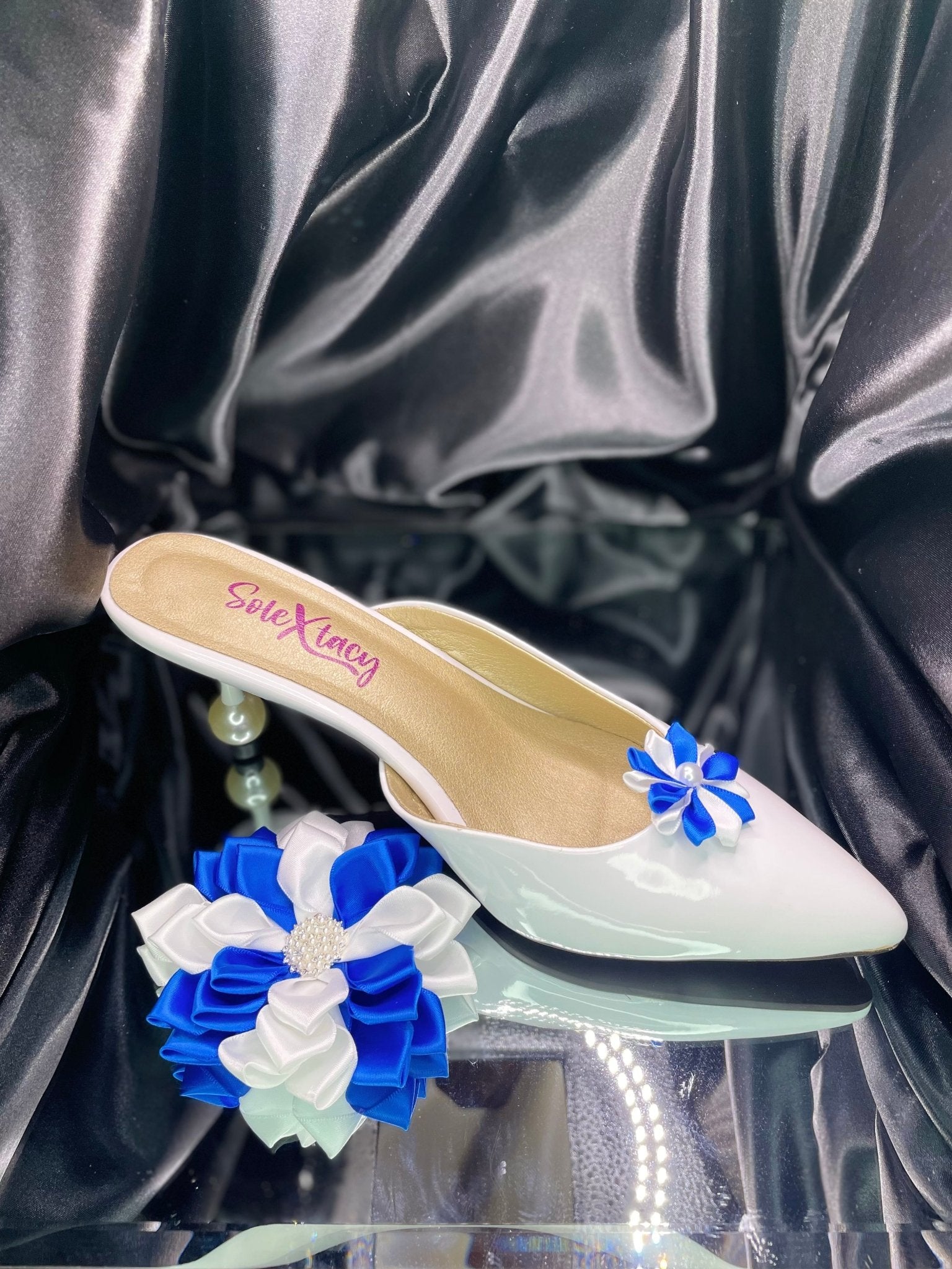 White flats with blue and white Kanzashi flower cluster on the toe