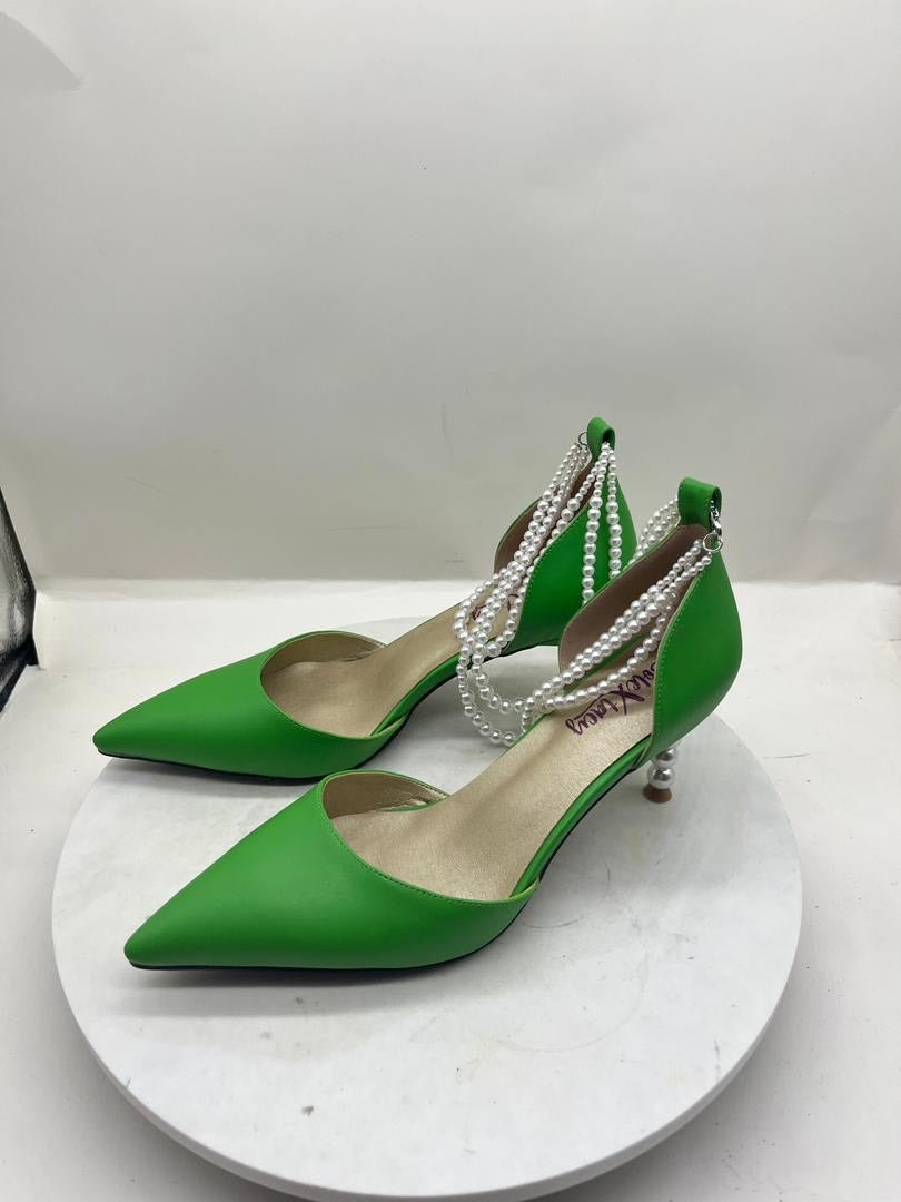 Green pointed-toe slingback stiletto pumps with pearl chain trim and dangling pearls