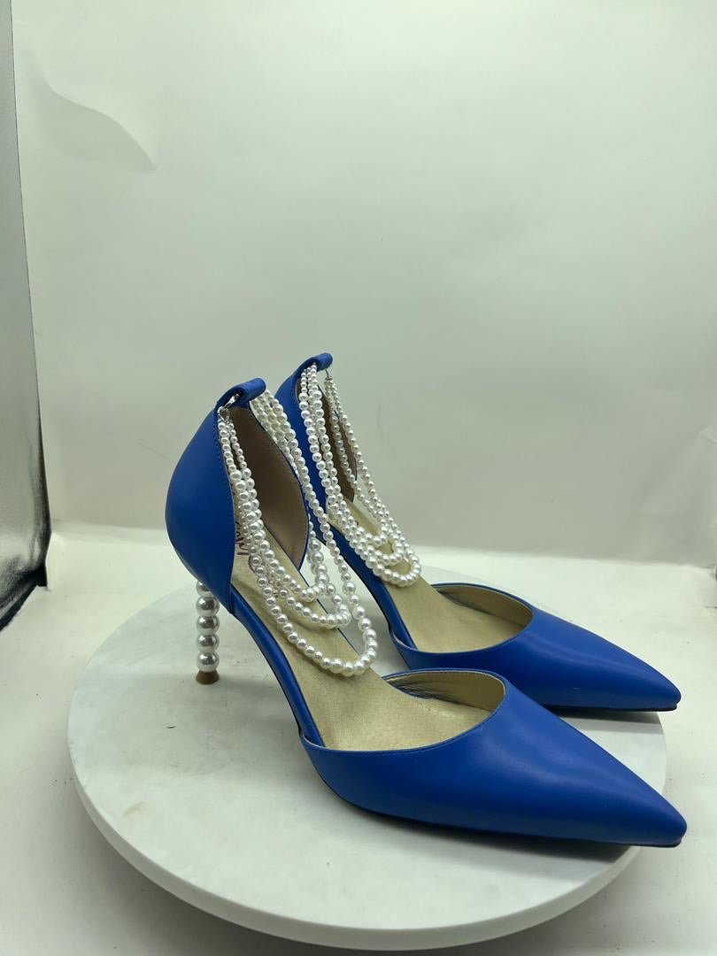 Blue pointed-toe stiletto pumps with pearl chain trim and dangling pearl accents