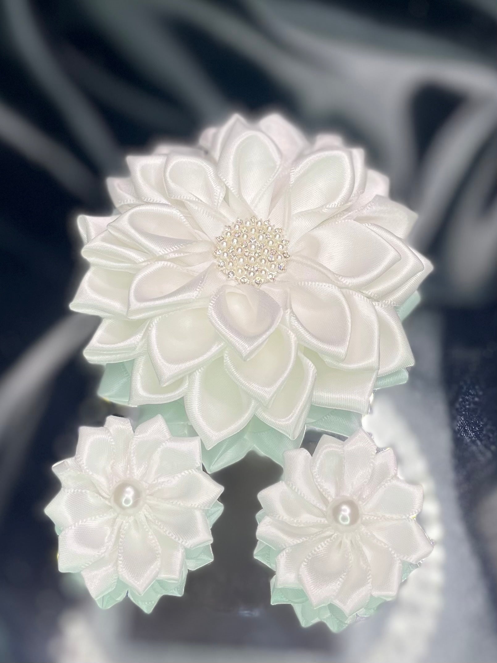White kanzashi flower set with one large rosette and two small rosettes